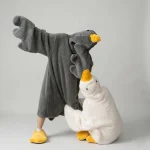 Silly Goose Pjs What are Silly Goose PJs? Black adult goose onesie wearable blanket with hood and matching yellow slippers.
