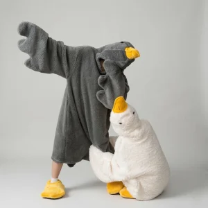 What are Silly Goose PJs? Black adult goose onesie wearable blanket with hood and matching yellow slippers.